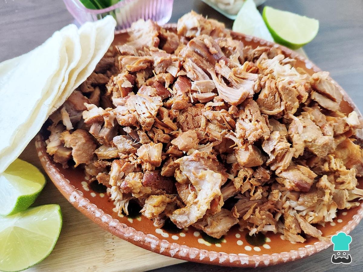 Freshly chopped carnitas on a plate at Taco District